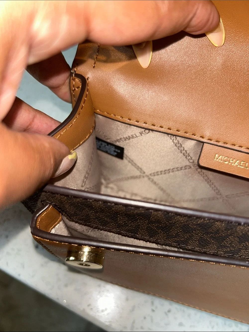 Like new Michael Kors Brown Logo Crossbody with Tan Leather and Gold Chain